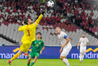 Indonesia's goalkeeper Maarten Vincent Paes (L) jumps to catch the ball during the 2026 World Cup Asian qualification football match between Saudi Arabia and Indonesia at Bung Karno Stadium in Jakarta on November 19, 2024. (Photo by BAY ISMOYO / AFP) (Photo by BAY ISMOYO/AFP via Getty Images)