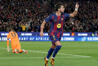 TOPSHOT - Barcelona's Spanish forward #07 Ferran Torres celebrates scoring his team's third goal during the Spanish league football match between FC Barcelona and Club Atletico de Madrid at Camp Nou Stadium in Barcelona on December 2, 2025. (Photo by Lluis GENE / AFP via Getty Images)