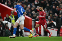 Liverpool's Egyptian striker #11 Mohamed Salah runs with the ball during the English Premier League football match between Liverpool and Sunderland at Anfield in Liverpool, north west England on December 3, 2025. (Photo by Paul ELLIS / AFP via Getty Images) / RESTRICTED TO EDITORIAL USE. No use with unauthorized audio, video, data, fixture lists, club/league logos or 'live' services. Online in-match use limited to 120 images. An additional 40 images may be used in extra time. No video emulation. Social media in-match use limited to 120 images. An additional 40 images may be used in extra time. No use in betting publications, games or single club/league/player publications. /