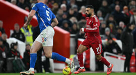 Liverpool's Egyptian striker #11 Mohamed Salah runs with the ball during the English Premier League football match between Liverpool and Sunderland at Anfield in Liverpool, north west England on December 3, 2025. (Photo by Paul ELLIS / AFP via Getty Images) / RESTRICTED TO EDITORIAL USE. No use with unauthorized audio, video, data, fixture lists, club/league logos or 'live' services. Online in-match use limited to 120 images. An additional 40 images may be used in extra time. No video emulation. Social media in-match use limited to 120 images. An additional 40 images may be used in extra time. No use in betting publications, games or single club/league/player publications. /