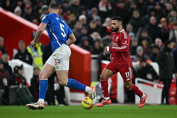 Liverpool's Egyptian striker #11 Mohamed Salah runs with the ball during the English Premier League football match between Liverpool and Sunderland at Anfield in Liverpool, north west England on December 3, 2025. (Photo by Paul ELLIS / AFP via Getty Images) / RESTRICTED TO EDITORIAL USE. No use with unauthorized audio, video, data, fixture lists, club/league logos or 'live' services. Online in-match use limited to 120 images. An additional 40 images may be used in extra time. No video emulation. Social media in-match use limited to 120 images. An additional 40 images may be used in extra time. No use in betting publications, games or single club/league/player publications. /