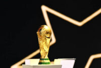 The FIFA World Cup Trophy is displayed on the stage during the draw for the 2026 FIFA Football World Cup taking place in the US, Canada and Mexico, at the Kennedy Center, in Washington, DC, on December 5, 2025. (Photo by Mandel NGAN / POOL / AFP via Getty Images)