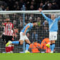 Manchester City's Ruben Dias (centre) celebrates with Bernardo Silva after scoring their side's first goal of the game during the Premier League match at the Etihad Stadium, Manchester. Picture date: Saturday December 6, 2025. (Photo by Martin Rickett/PA Images via Getty Images)