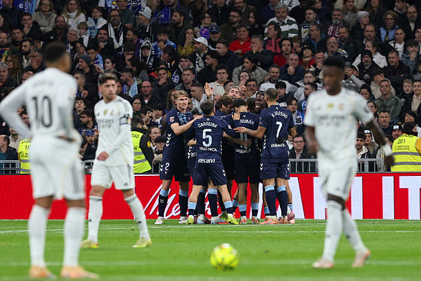 Celta de Vigo players celebrate scoring their first goal during the Spanish league football match between Real Madrid CF and RC Celta de Vigo at the Santiago Bernabeu Stadium in Madrid on December 7, 2025. (Photo by Thomas COEX / AFP via Getty Images)