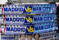 Real Madrid and Manchester City scarfs for sale near the Bernabeu Stadium, Madrid. Picture date: Tuesday December 9, 2025. (Photo by Mike Egerton/PA Images via Getty Images)