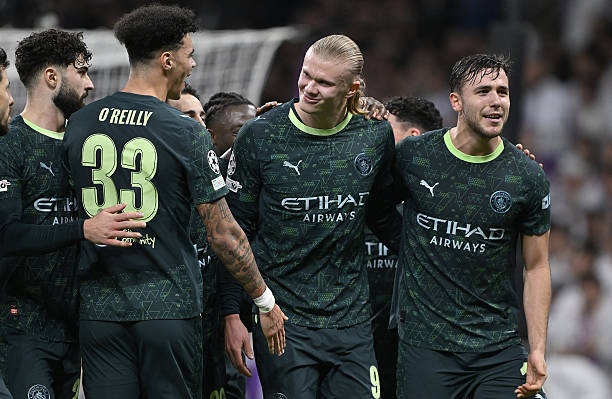MADRID, SPAIN - DECEMBER 10: Manchester City's Erling Haaland (C) celebrates his goal with teammates during the UEFA Champions League Matchday 6 game against Real Madrid at Bernabeu Stadium in Madrid, Spain, on December 10, 2025. (Photo by Burak Akbulut/Anadolu via Getty Images)