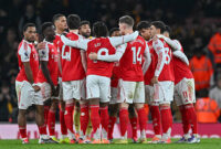 LONDON, ENGLAND - DECEMBER 13:  Arsenal players huddle during the Premier League match between Arsenal and Wolverhampton Wanderers at Emirates Stadium on December 13, 2025 in London, England. (Photo by Vince Mignott/MB Media/Getty Images)
