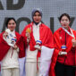 Mubarokah Dewi Laila of Indonesia, the gold medalist, celebrates on the podium during the medal ceremony with Karini Dominique Rachmawati of Indonesia, the silver medalist, and Phi Thanh Thao of Vietnam, the bronze medalist, at the women's 10m Air Rifle final at the 33rd Sea Games in SAT Shooting Range, Bangkok, Thailand, on December 13, 2025. (Photo by Anusak Laowilas/NurPhoto via Getty Images)