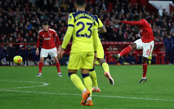Nottingham Forest's Ivorian midfielder #06 Ibrahim Sangare scores the team's third goal during the English Premier League football match between Nottingham Forest and Tottenham Hotspur at The City Ground in Nottingham, central England, on December 14, 2025. (Photo by Darren Staples / AFP via Getty Images) / RESTRICTED TO EDITORIAL USE. No use with unauthorized audio, video, data, fixture lists, club/league logos or 'live' services. Online in-match use limited to 120 images. An additional 40 images may be used in extra time. No video emulation. Social media in-match use limited to 120 images. An additional 40 images may be used in extra time. No use in betting publications, games or single club/league/player publications. /