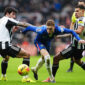 Newcastle United's Sandro Tonali and Bruno Guimaraes challenge Chelsea's Cole Palmer (centre) during the Premier League match at St James' Park, Newcastle. Picture date: Saturday December 20, 2025. (Photo by Owen Humphreys/PA Images via Getty Images)