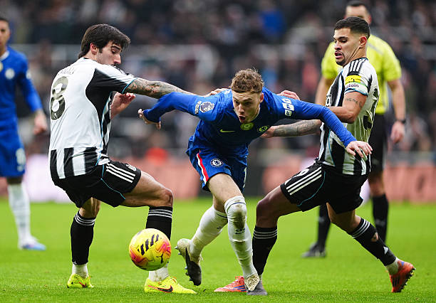 Newcastle United's Sandro Tonali and Bruno Guimaraes challenge Chelsea's Cole Palmer (centre) during the Premier League match at St James' Park, Newcastle. Picture date: Saturday December 20, 2025. (Photo by Owen Humphreys/PA Images via Getty Images)