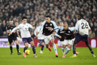 Manchester United's Lisandro Martinez (left) and Aston Villa's Morgan Rogers (second right) battle for the ball during the Premier League match at Villa Park, Birmingham. Picture date: Sunday December 21, 2025. (Photo by Nick Potts/PA Images via Getty Images)