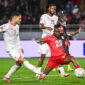 Tunisia's forward #07 Elias Achouri scores agoal in front of Uganda's defender #23 Aziz Kayondo during the Africa Cup of Nations (CAN) Group C football match between Tunisia and Uganda at Rabat Olympic Stadium in Rabat on December 23, 2025. (Photo by SEBASTIEN BOZON / AFP via Getty Images)