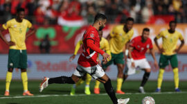 Egypt's forward #10 Mohamed Salah shoots from the penalty spot to score the team's first goal during the Africa Cup of Nations (CAN) Group B football match between Egypt and South Africa at Adrar Stadium in Agadir on December 26, 2025. (Photo by FRANCK FIFE / AFP via Getty Images)