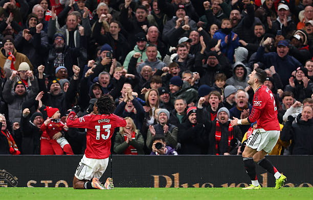 MANCHESTER, ENGLAND - DECEMBER 26: Patrick Dorgu of Manchester United celebrates scoring his team's first goal during the Premier League match between Manchester United and Newcastle United at Old Trafford on December 26, 2025 in Manchester, England. (Photo by Molly Darlington/Copa/Getty Images)