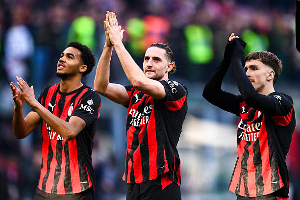 MILAN, ITALY - DECEMBER 28: David Odogu of AC Milan, Adrian Rabiot of AC Milan, Alexis Saelemaekers of AC Milan celebrating their sides win during the Serie A match between AC Milan and Hellas Verona FC at Giuseppe Meazza Stadium on December 28, 2025 in Milan, Italy. (Photo by Alberto Gandolfo/BSR Agency/Getty Images)