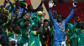 Senegal players celebrate with the trophy after winning the Africa Cup of Nations (CAN) final football match against Morocco at the Prince Moulay Abdellah Stadium in Rabat on January 18, 2026. (Photo by FRANCK FIFE / AFP via Getty Images)